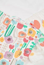 CONJUNTO DE PUNTO BLANCO CON FLORES